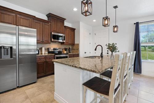 a kitchen with a granite counter top and stainless steel appliances at Pampered Pillow in Canyon Lake
