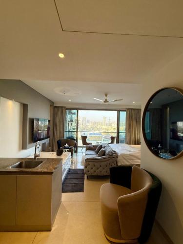a large room with a bed and a living room at New Private Turkish Luxe Jacuzzi Studio in Gurgaon