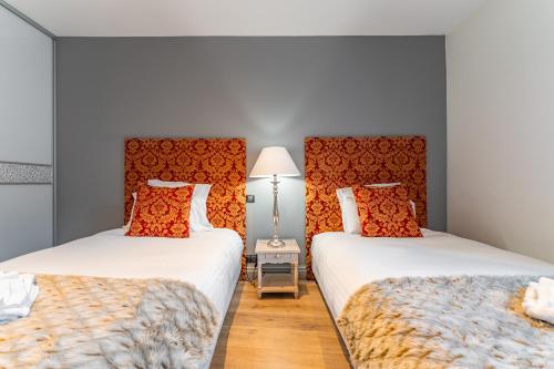 Ένα ή περισσότερα κρεβάτια σε δωμάτιο στο Superbe appartement de 2 chambres au cœur du quartier Gambetta