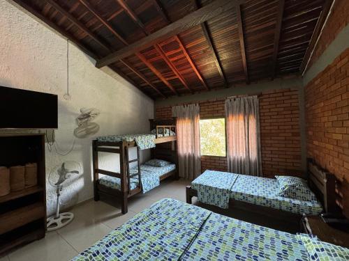 Ένα ή περισσότερα κρεβάτια σε δωμάτιο στο Hotel Campestre UMPALÁ