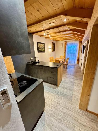 a kitchen with a stove top oven in a room at Residence Palmai in Ortisei