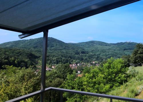 a view of the mountains from the balcony of a house at Alsace Panorama in Barr