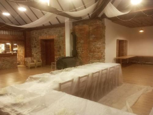 a room with a dance floor with white sheets on it at Penzion a restaurace Myslivna Kolence - Třeboňsko in Třeboň