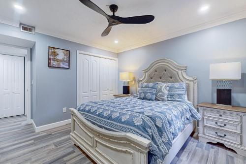 a bedroom with a bed and a ceiling fan at The Irons #3 in Pigeon Forge