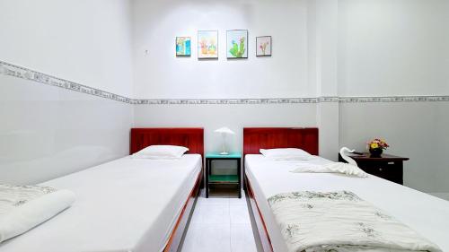 Katil atau katil-katil dalam bilik di Quoc Dinh Guest House