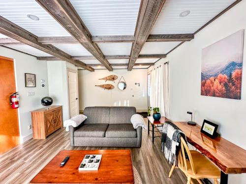 a living room with a couch and a table at Hike BIke Chill in Collingwood