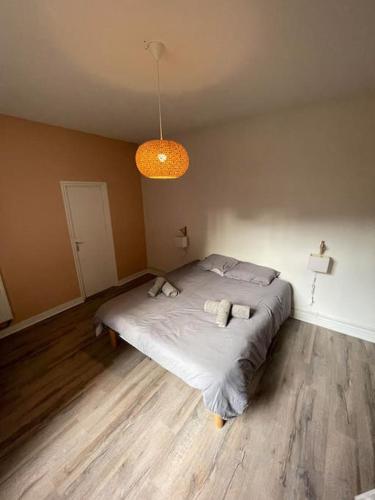 En eller flere senge i et værelse på Appartement proche cathédrale