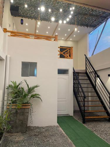 a house with a staircase and a stair case at Casa Apartament Paseo Del Mar in Chimbote