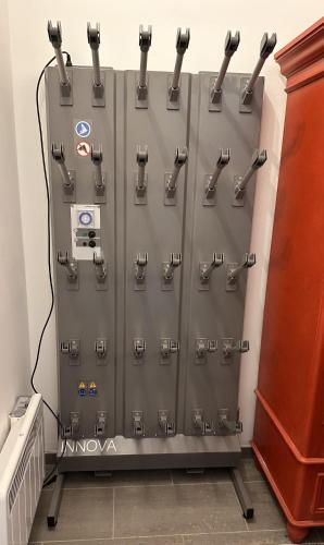 a row of metal lockers in a room at Above the Clouds - spacious chalet with great view in Plan Fey