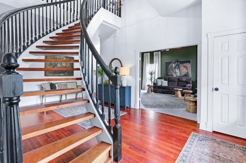 a spiral staircase in a home with a living room at Hidden Hills in Fischer