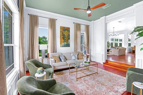 a living room with a couch and chairs and a table at Hidden Hills in Fischer