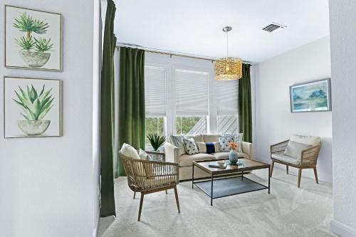 a living room with a couch and a table at Hidden Hills in Fischer