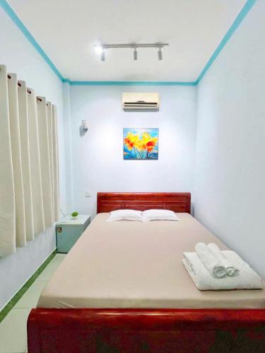 Katil atau katil-katil dalam bilik di Quoc Dinh Guest House