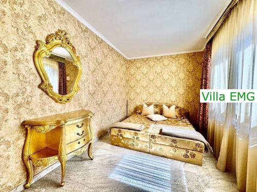 a bedroom with a bed and a mirror and a dresser at Luxury Spa Villa EMG Karlsruhe Baden-Baden Rastatt - Gernsbach in Gernsbach