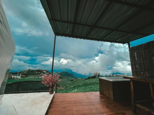 a balcony with a view of a mountain at Tubburk glamping VIP in Ban Maeo Thap Boek
