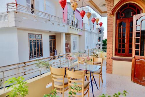 a patio with a table and chairs on a building at Hue Ancient Town - Homestay in Hue in Hue