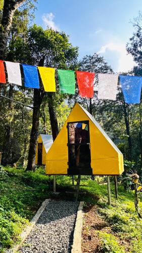 a play house with flags hanging above it at Skyfall 900kandi in Meppādi