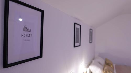 a picture on a wall with two pictures on it at Apartman M-A-P in Bukovlje