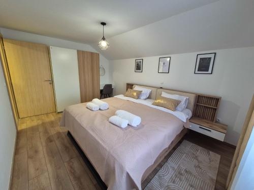 Ένα ή περισσότερα κρεβάτια σε δωμάτιο στο Apartman M-A-P