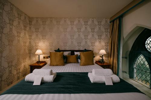 Letto o letti in una camera di The Old Palace Lodge