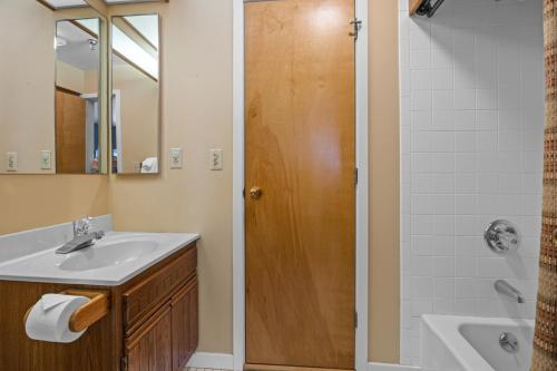 a bathroom with a sink and a shower at Stratton's Crown Point Mountain Views, Top Floor newlly furnished in Stratton