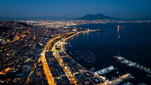 an aerial view of a city at night at Suite Malu in Naples