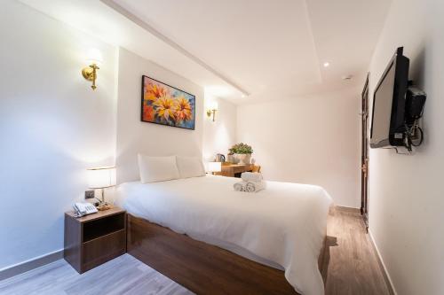 Postel nebo postele na pokoji v ubytování Thuan Phat Hostel