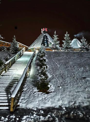 a pyramid in the snow with trees in the background at KOZAK Apartments & Restaurant in Mojkovac
