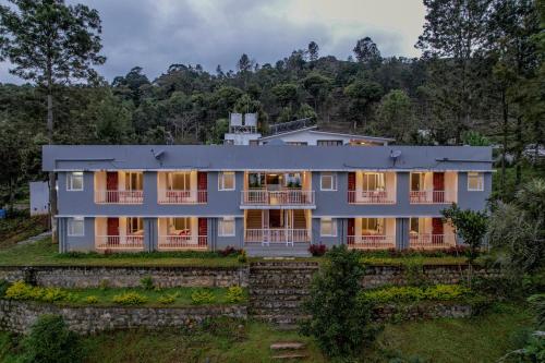 an aerial view of a large house at Shola Gardens , Kotagiri in Kotagiri