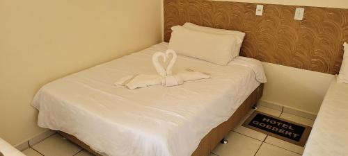 Ένα ή περισσότερα κρεβάτια σε δωμάτιο στο Hotel Goedert