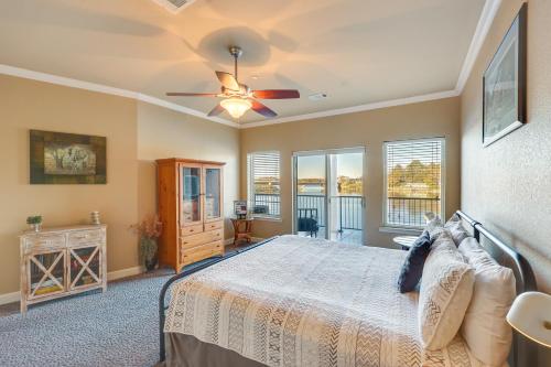 a bedroom with a bed and a ceiling fan at Pool and Lake Hamilton Access Hot Springs Condo! in Hot Springs