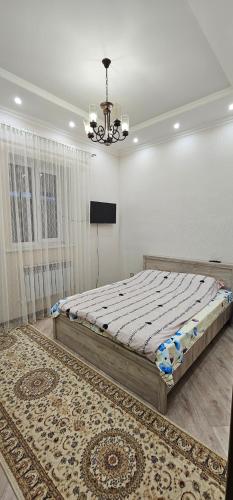 Voodi või voodid majutusasutuse Гостевой дом toas