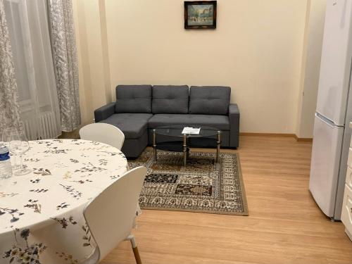 a living room with a couch and a table at Salve Teplice in Teplice