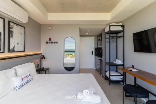 Cama o camas de una habitación en Spot Jurere sofisticación junto al mar - SPJ's
