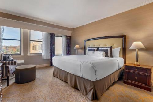 a bedroom with a large bed and a large window at Omni Shoreham Hotel in Washington