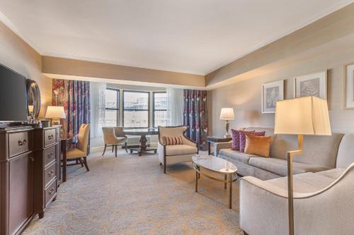 a living room with a couch and a table at Omni Shoreham Hotel in Washington