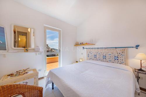 Ένα ή περισσότερα κρεβάτια σε δωμάτιο στο Villa Josephine - Sardinia Unlimited