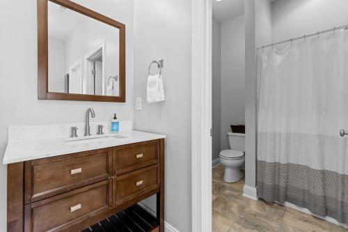 a bathroom with a sink and a toilet at Lake Escape by AvantStay Lakefront Private Dock in Mooresville