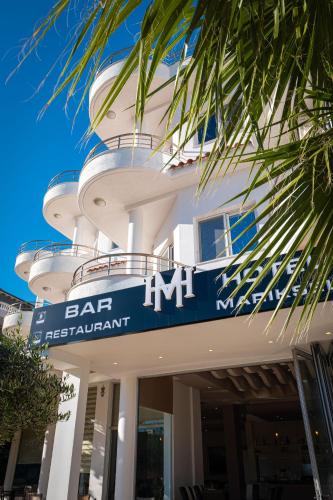 a building with a bar restaurant sign in front of it at Mariksel HOTEL in Ksamil