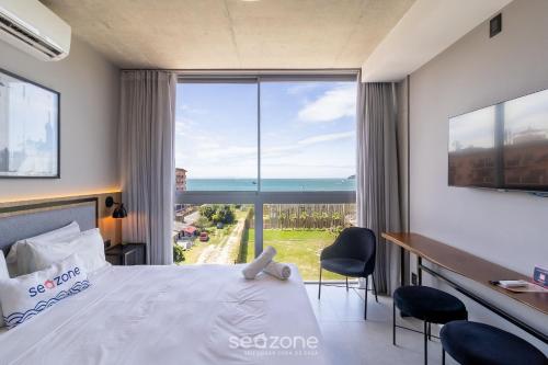 Cama o camas de una habitación en Spot Jurere sofisticación junto al mar - SPJ's