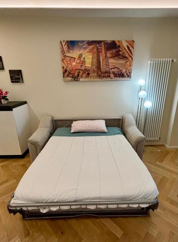 Ένα ή περισσότερα κρεβάτια σε δωμάτιο στο Apartament Bologna-Stadio 1