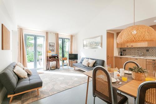 a living room with a couch and a table at Vila Santa Maria - Cosy Guest House in Sintra