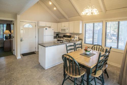 a kitchen and dining room with a table and chairs at Waterwood Townhouses in New Bern
