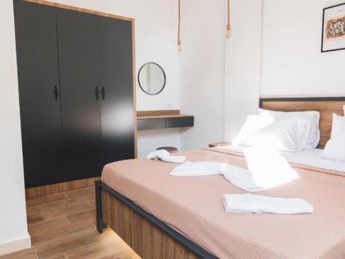 a bedroom with a bed with towels on it at Hayal Boutique Hotel in Bar