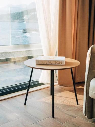 a box on a table in front of a window at Hayal Boutique Hotel in Bar