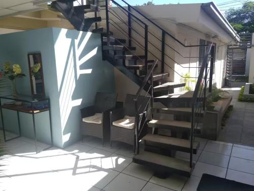 a staircase leading up to a house at Runway 108 in Managua