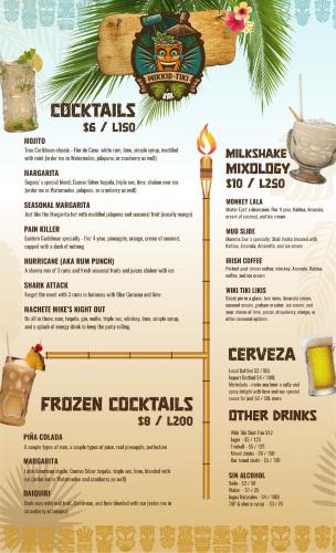 a menu for a restaurant with a drink at Wikkid Resort in Dixon Cove