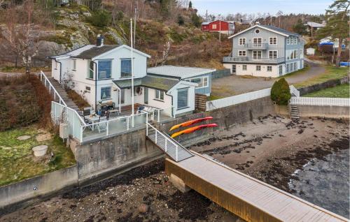 an aerial view of a house with surfboards on a wall at Gorgeous Home In Sandefjord With Wifi in Sandefjord