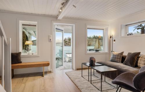 a living room with a couch and a table at Gorgeous Home In Sandefjord With Wifi in Sandefjord