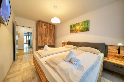 Ένα ή περισσότερα κρεβάτια σε δωμάτιο στο Apartment Valentina - by Alpen Apartments